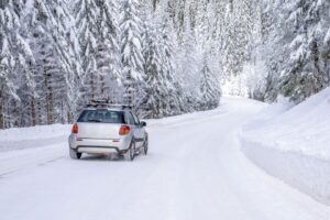 Winter driving conditions showing snowy mountain road