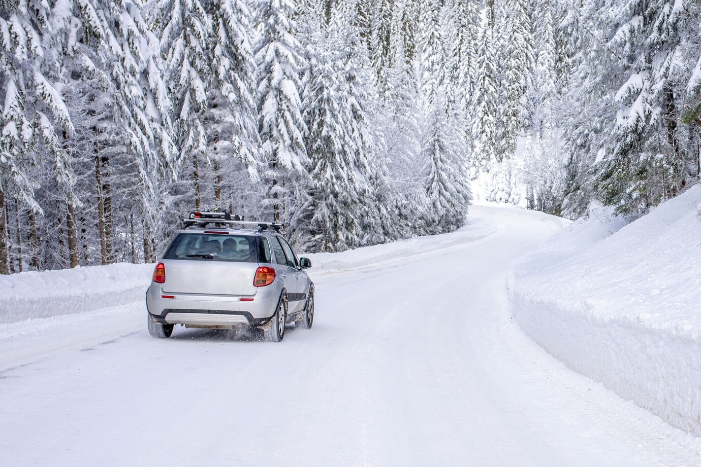 Winter driving conditions showing snowy mountain road